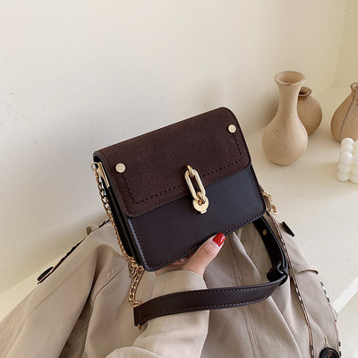 Modern női táska eko bőrből, hosszú fém fogantyúval