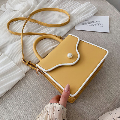 Modern női bőr táska gyöngy díszítéssel és két fogantyúval