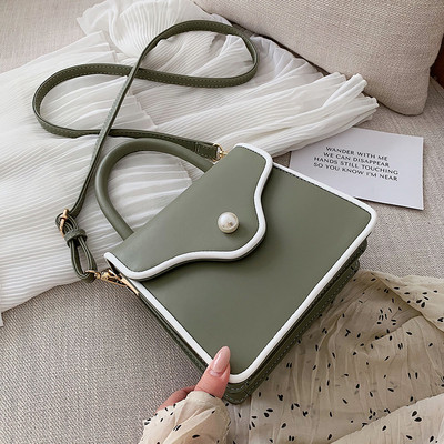 Modern női bőr táska gyöngy díszítéssel és két fogantyúval