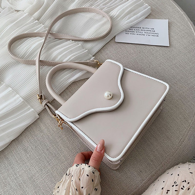 Modern női bőr táska gyöngy díszítéssel és két fogantyúval