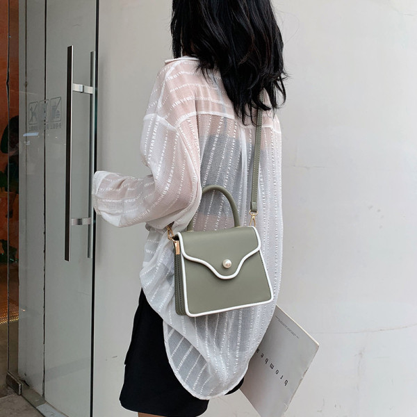 Modern női bőr táska gyöngy díszítéssel és két fogantyúval