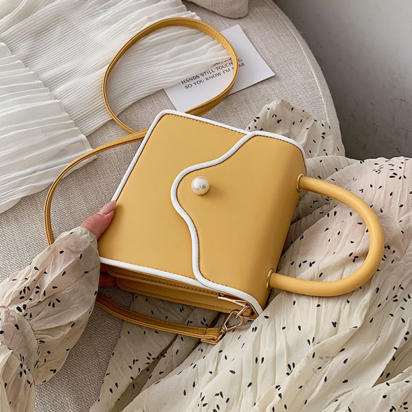 Modern női bőr táska gyöngy díszítéssel és két fogantyúval