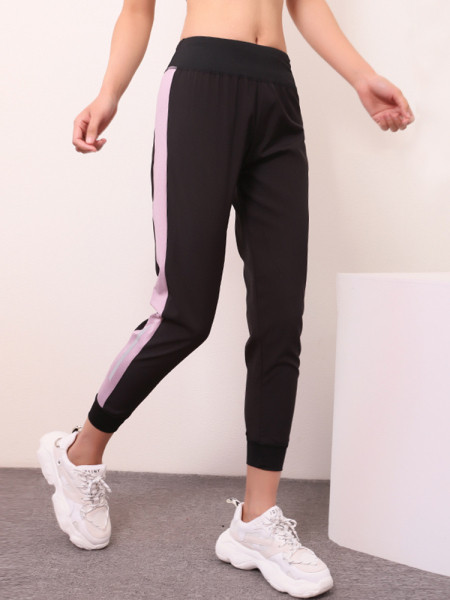 Női sportnadrág gumírozott derékkal és oldalsó szegéllyel