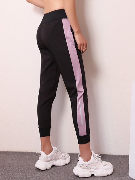 Női sportnadrág gumírozott derékkal és oldalsó szegéllyel