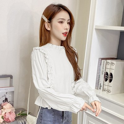 Modern női blúz hosszú ujjal és fürtökkel