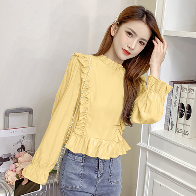 Modern női blúz hosszú ujjal és fürtökkel