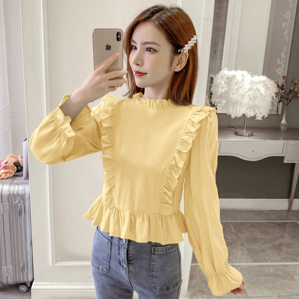 Modern női blúz hosszú ujjal és fürtökkel