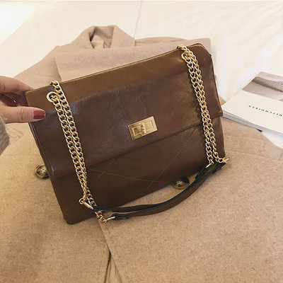 Laisvalaikio moteriška rankinė su ilga metaline rankena