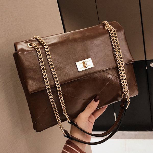 Laisvalaikio moteriška rankinė su ilga metaline rankena