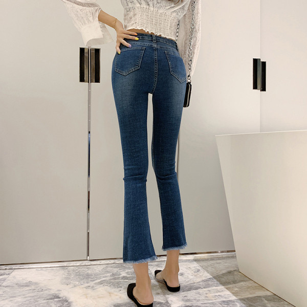 Aktuālie sieviešu džinsi Slim modelis ar augstu vidukli un saplēstiem motīviem