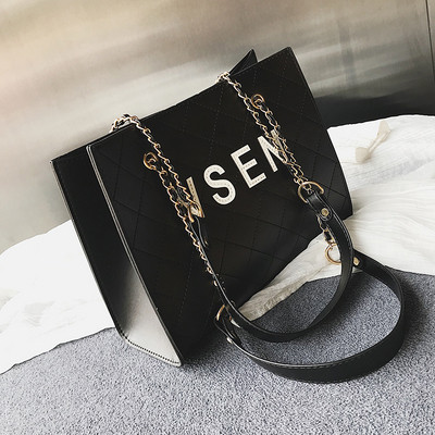 Moderna sieviešu ādas soma ar uzrakstu