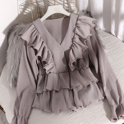 Stilinga moteriška iškirpta palaidinė ilgomis rankovėmis ir V formos iškirpte