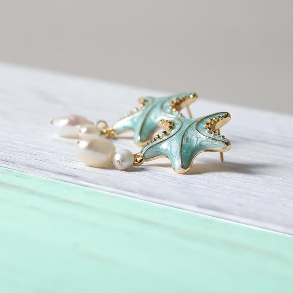 Sieviešu auskari jūras zvaigznes formā ar pērlēm