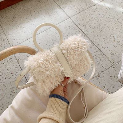 Moderna sieviešu dūnu soma ar garu ādas rokturi