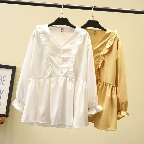 Modern női blúz hosszú ujjal és mély nyakkivágással