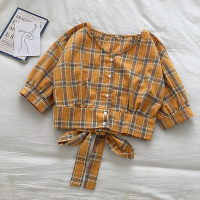 Retro stiliaus languoti moteriški marškiniai su raišteliais ir špicine iškirpte