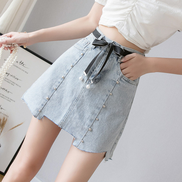 Asümmeetriline naiste teksaseelik kabe ja vööga