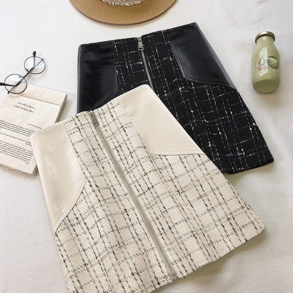 Kockás női szoknya magas derékkal, bőr elemekkel és cipzárral