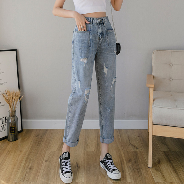 Mūsdienīgi sieviešu džinsi ar augstu vidukli un plēstiem elementiem