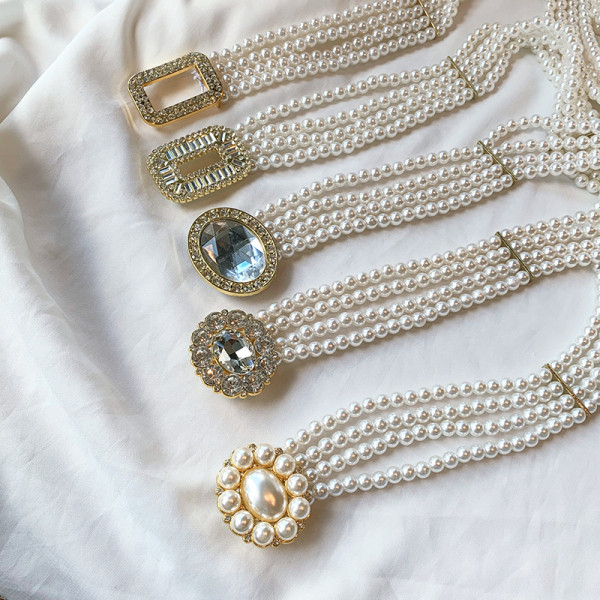 Aktuális gyöngyház női öv különböző csatokkal