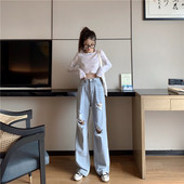 Plati sieviešu džinsi ar augstu vidukli un plēstiem motīviem