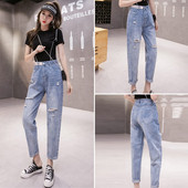 Ženske traperice visokog struka poderanih motiva dužine 9/10