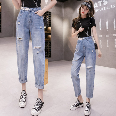 Ženske traperice visokog struka poderanih motiva dužine 9/10