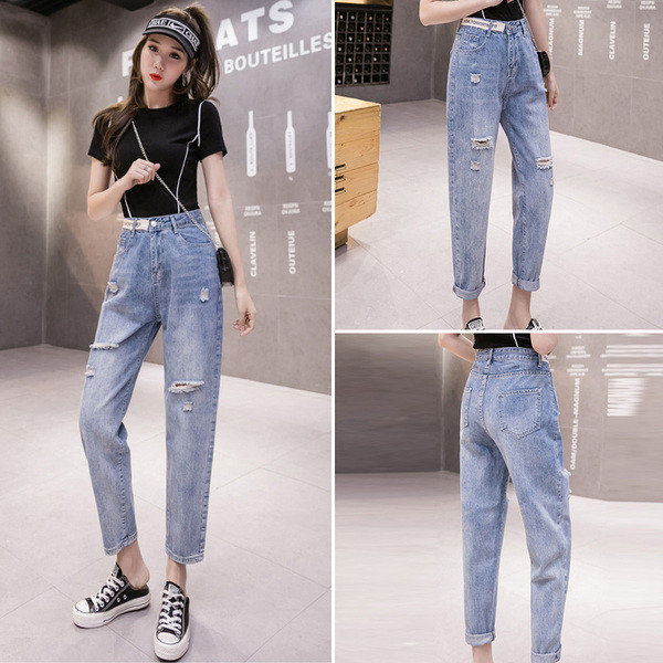 Ženske traperice visokog struka poderanih motiva dužine 9/10