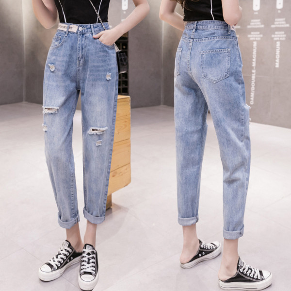 Ženske traperice visokog struka poderanih motiva dužine 9/10