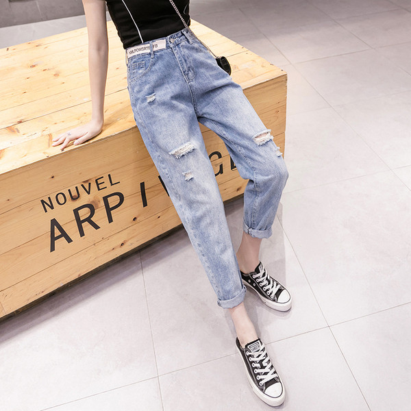 Ženske traperice visokog struka poderanih motiva dužine 9/10