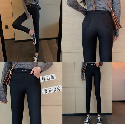 Juodos moteriškos kelnės aukštu juosmeniu ir sagomis