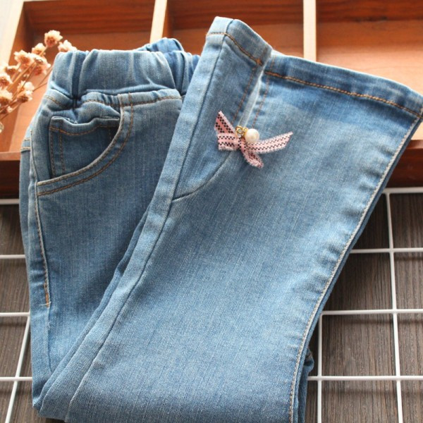 Mūsdienīgi bērnu džinsi ar lentīti un pērlēm meitenēm