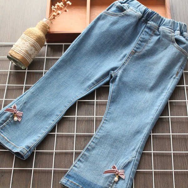 Mūsdienīgi bērnu džinsi ar lentīti un pērlēm meitenēm