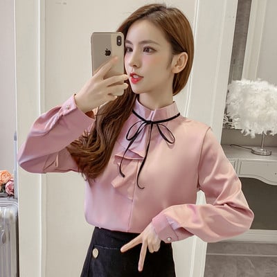 Stilīgs sieviešu krekls ar augstu apkakli, garām piedurknēm un lenti