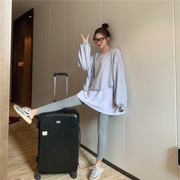 Hosszú női blúz ovális nyakkivágással - széles modell