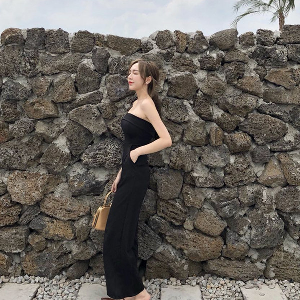 Moderns sieviešu kombinezons ar kabatām melnā krāsā