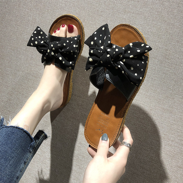 Női hétköznapi papucs lapos talppal és szalaggal