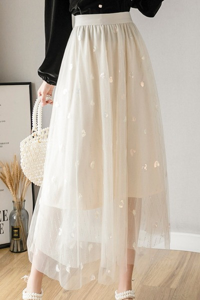 Novi model suknje ženskog kroja sa visokim strukom i šljokicama