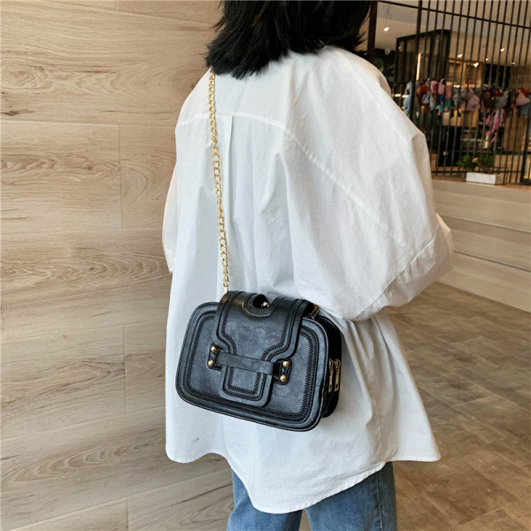 Moderna sieviešu maza soma no eko ādas ar garu rokturi