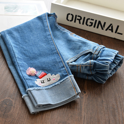 Šiuolaikiški vaikiški džinsai su siuvinėjimais ir plėšytais motyvais mergaitėms