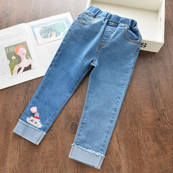 Šiuolaikiški vaikiški džinsai su siuvinėjimais ir plėšytais motyvais mergaitėms