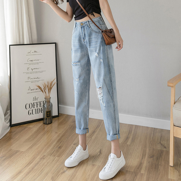 Ikdienas sieviešu džinsi ar augstu vidukli un plēstiem motīviem - plats modelis