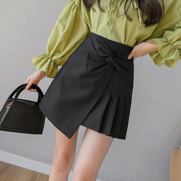 Stiilne lühike kõrge vöökoha ja dekoratiivse sõlmega naiste seelik