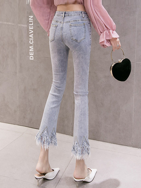 Modern női farmer magas derékkal és rojtokkal Slim modell