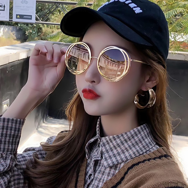 Model nou de ochelari de soare de dama cu forma rotunda si rame subtiri