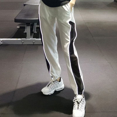 Moteriškos sportinės kelnės aukštu juosmeniu ir kišenėmis