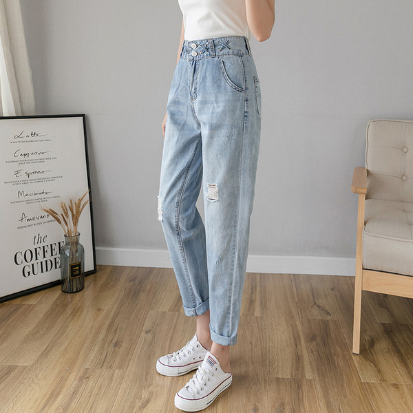 Blugi de dama lati cu talie inalta si motive rupte