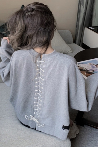 Sieviešu blūze ar garām piedurknēm un saitēm