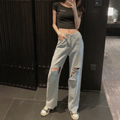 Lengvi moteriški džinsai su plėšytais motyvais ir aukštu liemeniu