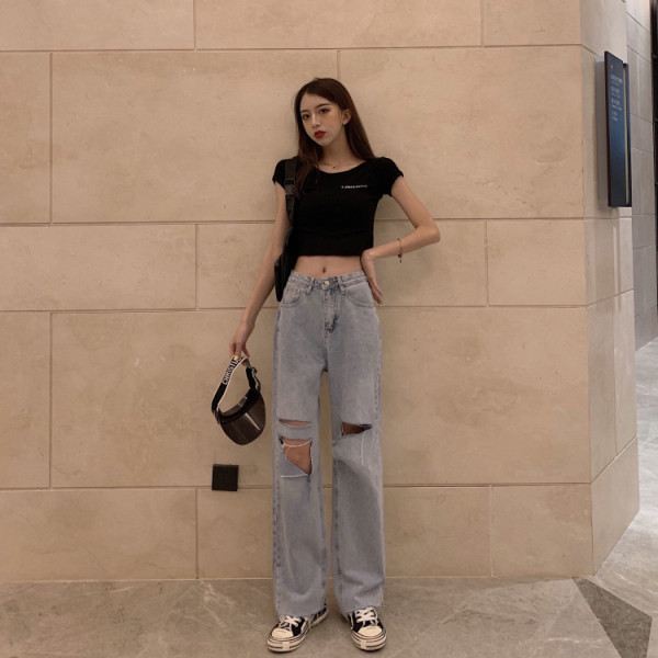 Lengvi moteriški džinsai su plėšytais motyvais ir aukštu liemeniu